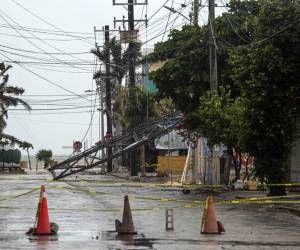 <i>Algunos daños causados ​​por fuertes vientos durante el paso de la tormenta tropical Beryl se ven en Progreso, Península de Yucatán, México, el 5 de julio de 2024. FOTO HUGO BORGES/AFP</i>