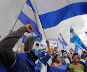 Manifestante anti Gobierno del presidente Daniel Ortega y su esposa Rosario Murillo, protestan en Managua, Nicaragua. / AFP PHOTO / Inti OCON